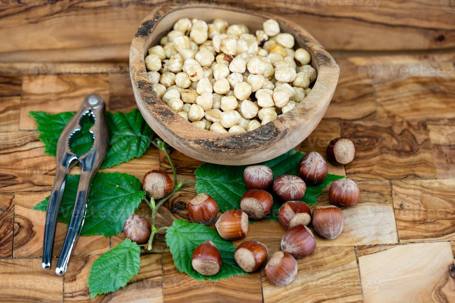 Hazelnut fruits Corylus avellana on olive wood photo