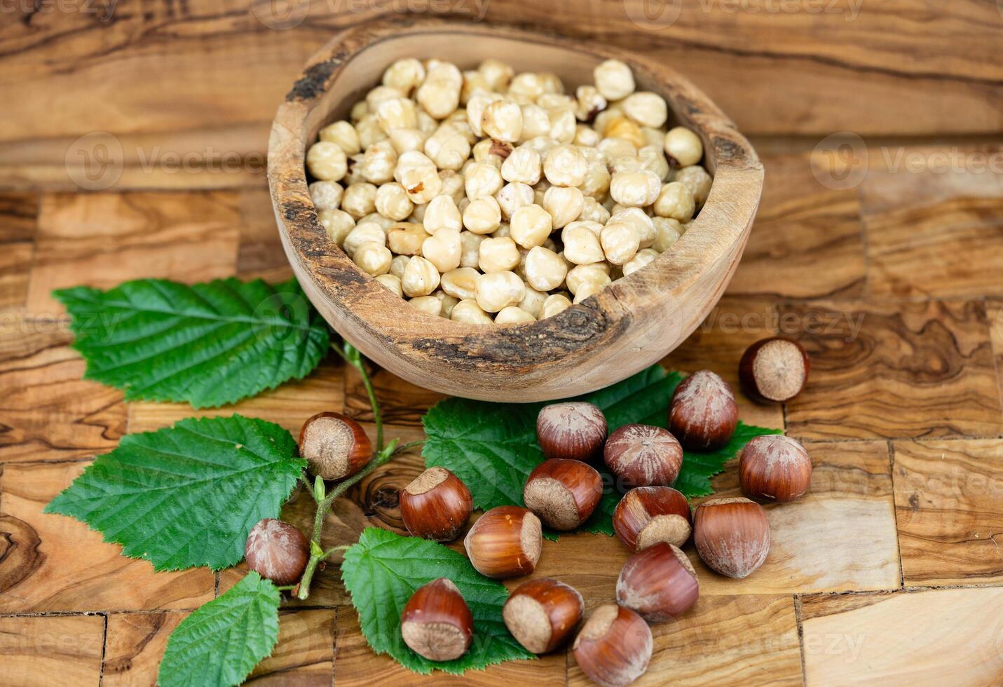 Hazelnut fruits Corylus avellana on olive wood photo