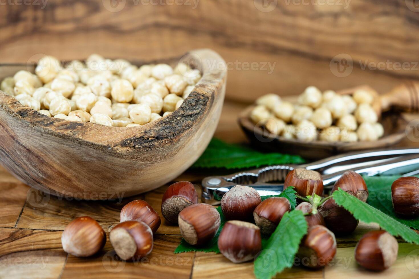 Hazelnut fruits Corylus avellana on olive wood photo