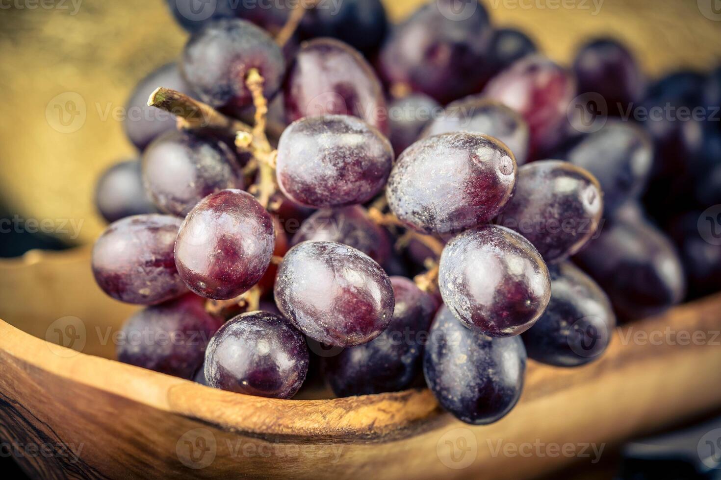 wine grapes on olive wood photo