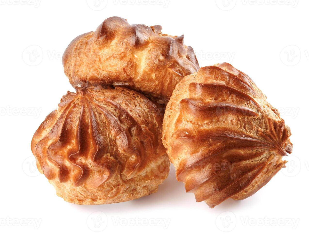 Three profiteroles isolated on a white background. Mini eclair on white. photo