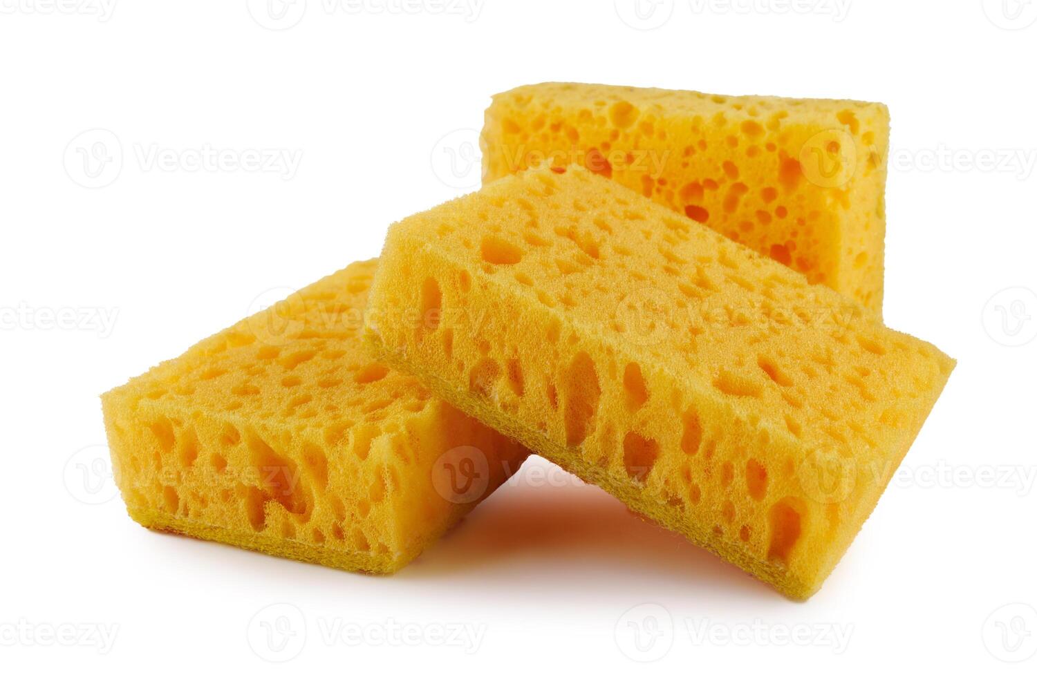 Several yellow sponges for washing dishes isolated on a white background. Household cleaning sponge. photo