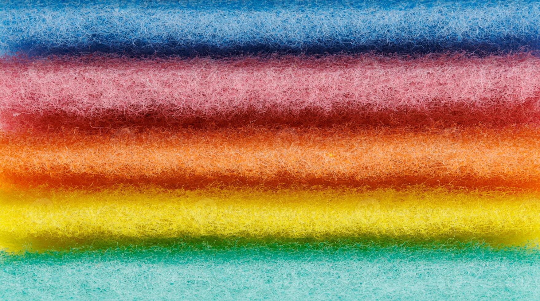 Multi-colored cleaning sponge. Background made from multi-colored cleaning cloth. photo