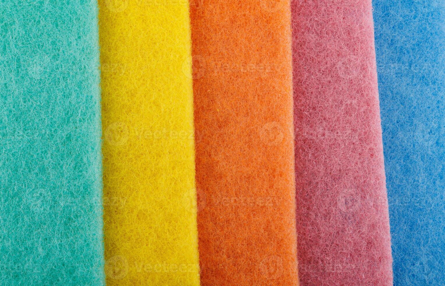 Multi-colored cleaning sponge. Background made from multi-colored cleaning cloth. photo