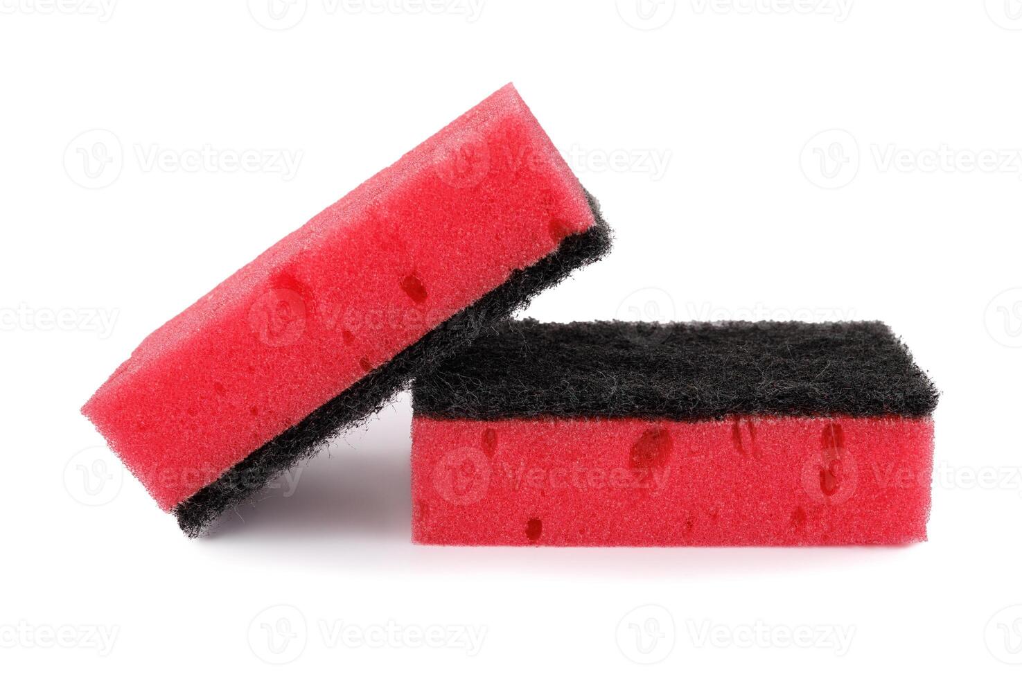A pair of red and black sponges isolated on a white background. Household sponges scattered on white. photo