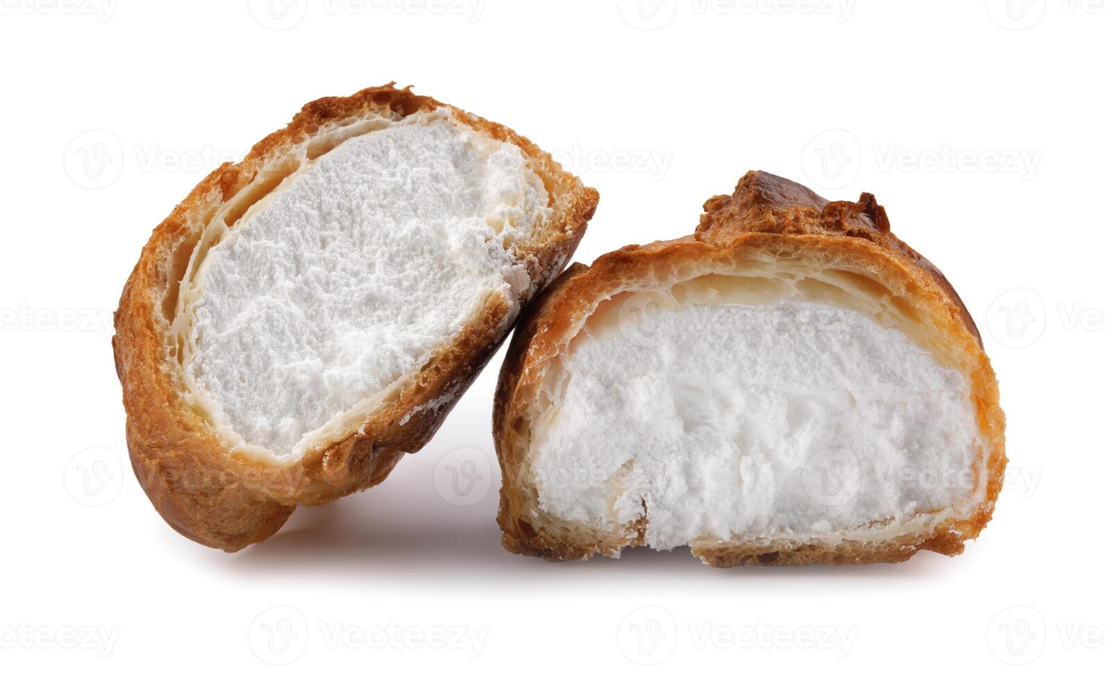 Porophytole cut in half with white cream isolated on a white background. Eclair with cream. photo