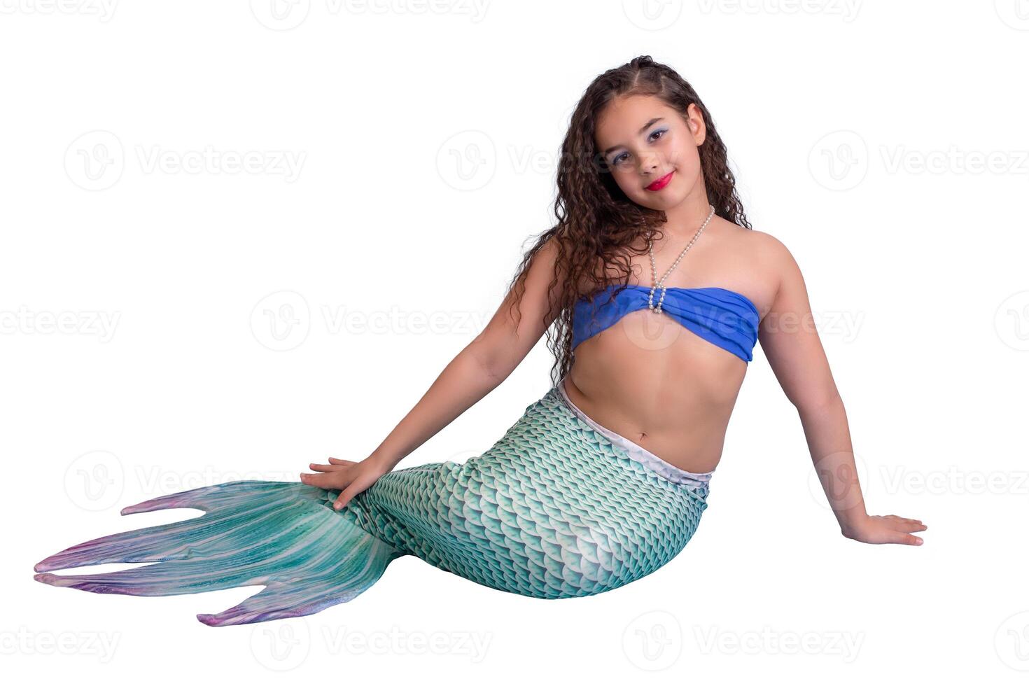 A beautiful smiling girl in a mermaid costume isolated on white background photo
