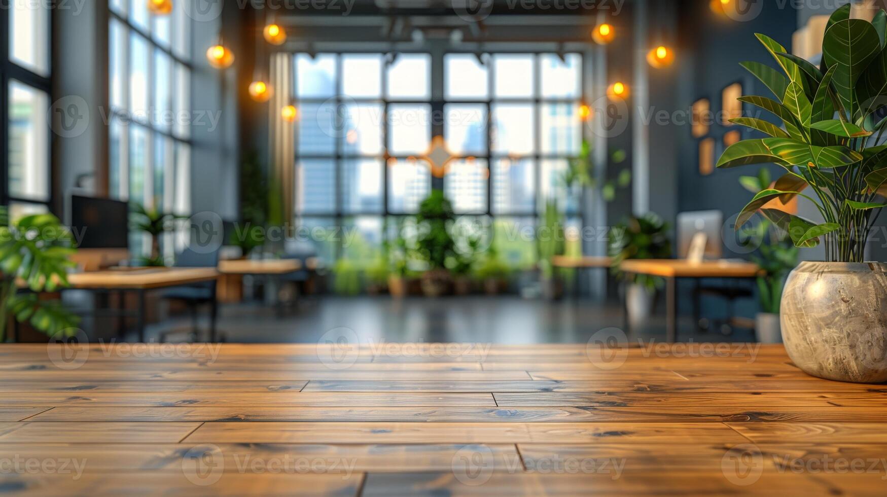 Spacious open-concept office with large windows, wooden floors, and numerous indoor plants. Natural light floods the area, creating a refreshing and welcoming workspace. photo