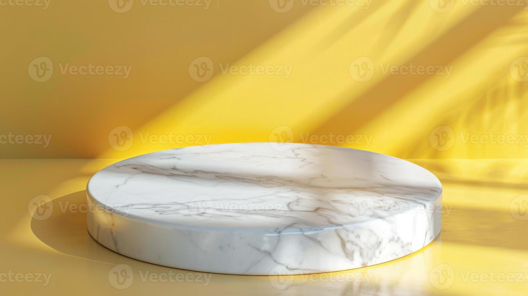 A round marble pedestal sits on a yellow surface, illuminated by sunlight that casts diagonal shadows across the scene. photo