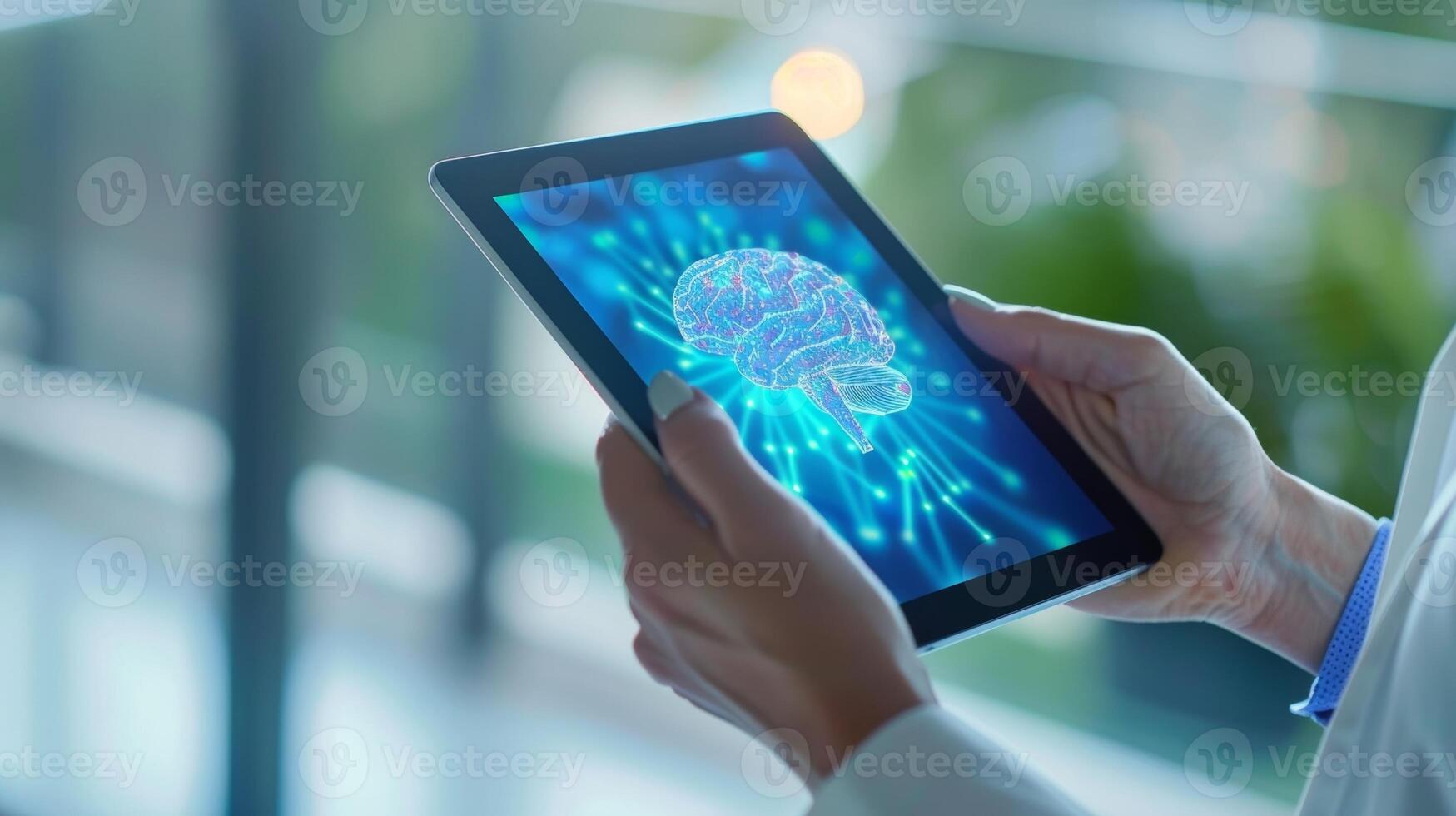 A hand holding a tablet with a brain health reminder app icon on the screen photo