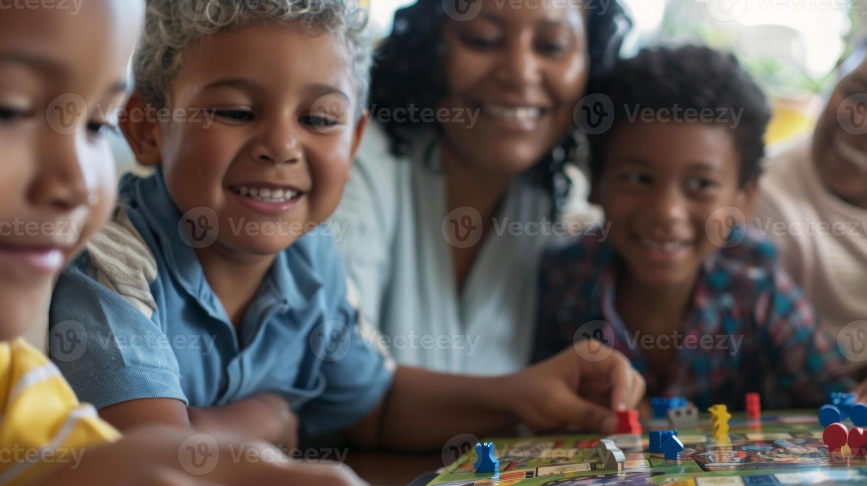 A family gathered around a board game enjoying quality time together photo