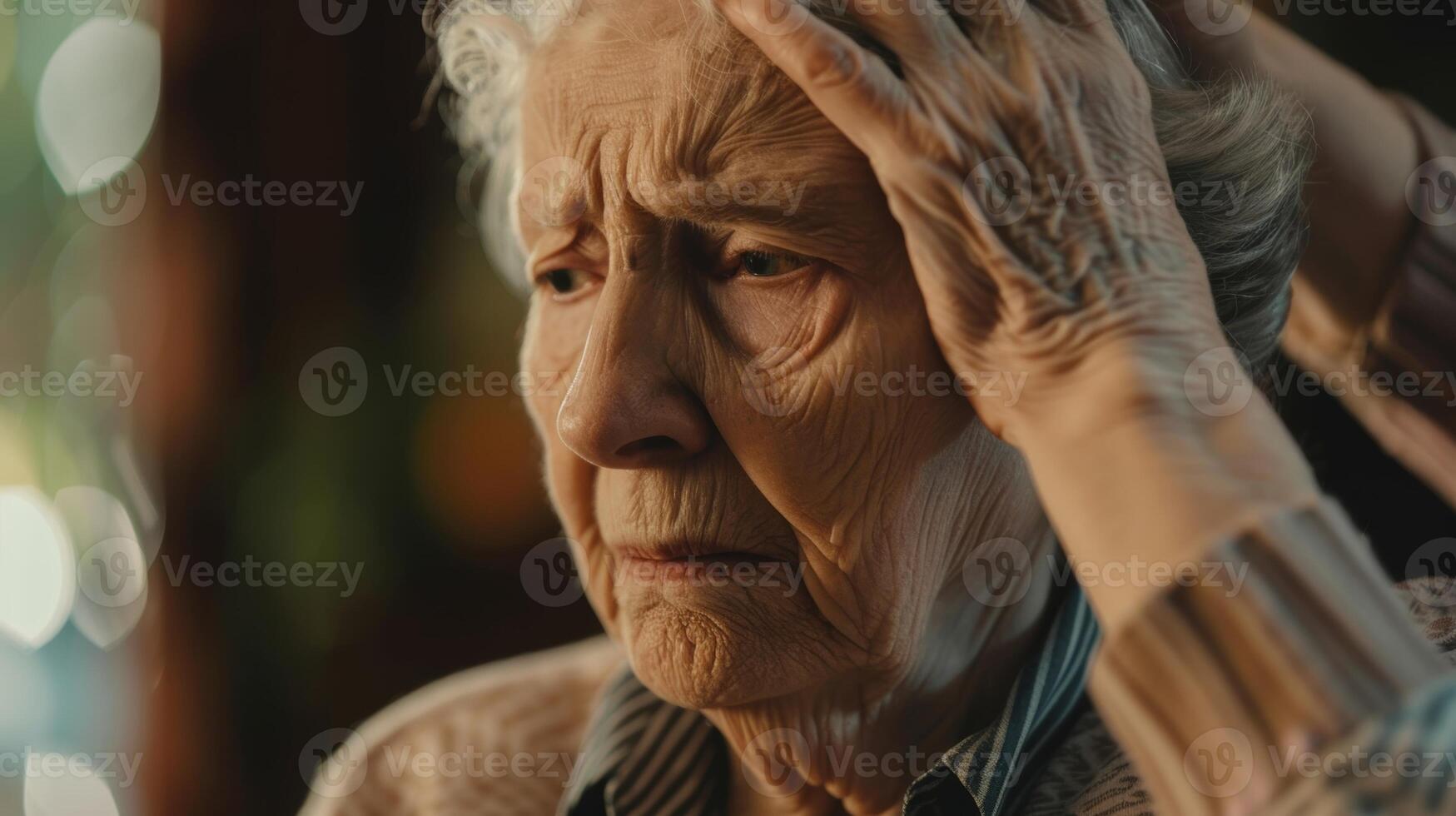 A caregiver trying to calm down an agitated older adult with dementia who is struggling with confusion and frustration photo