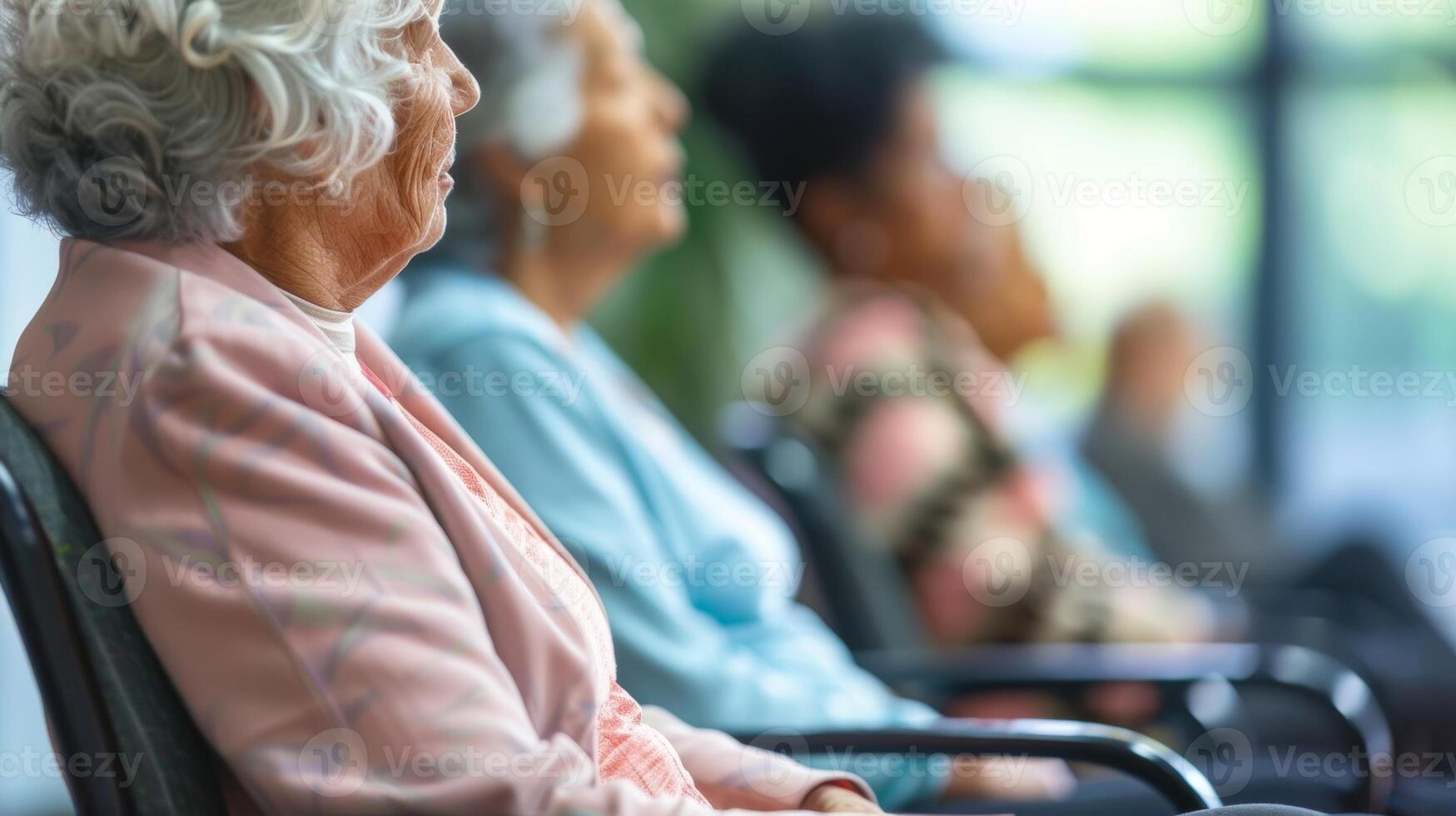 Seniors unwinding and relieving stress through a gentle chair exercise class at the senior centers fitness center photo