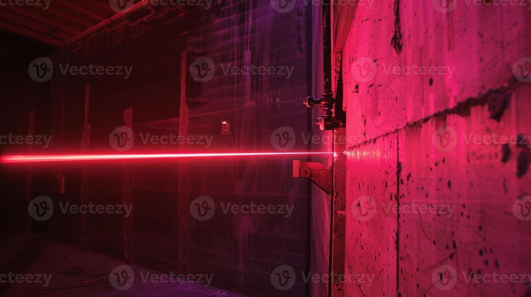 A laser beam carefully pointed at a wall ensuring that it will be perfectly vertical and aligned with the rest of the structure photo