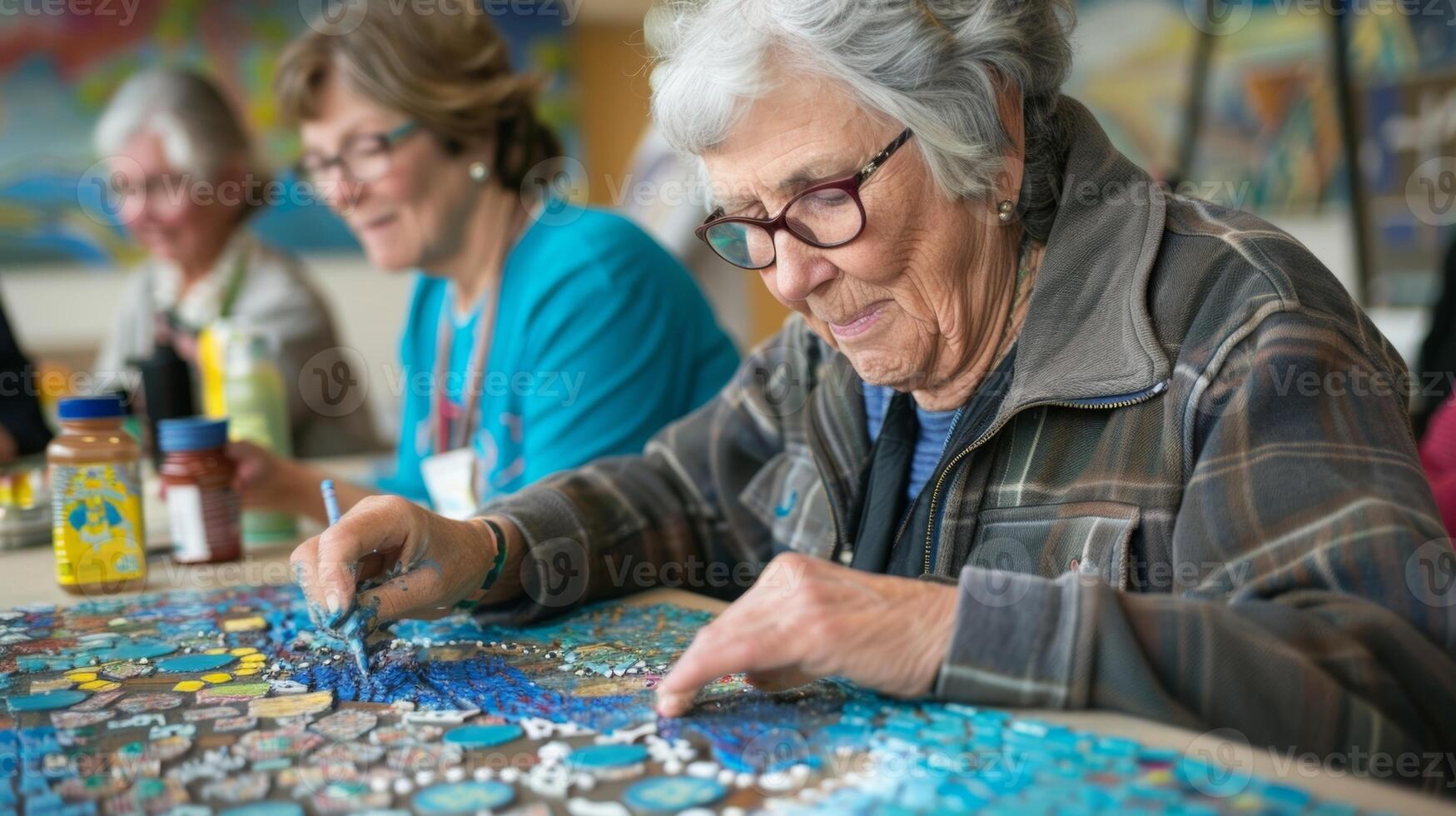 A local artist leads a workshop with community members to create a mosaic art piece that will be displayed in the lobby of the community center photo