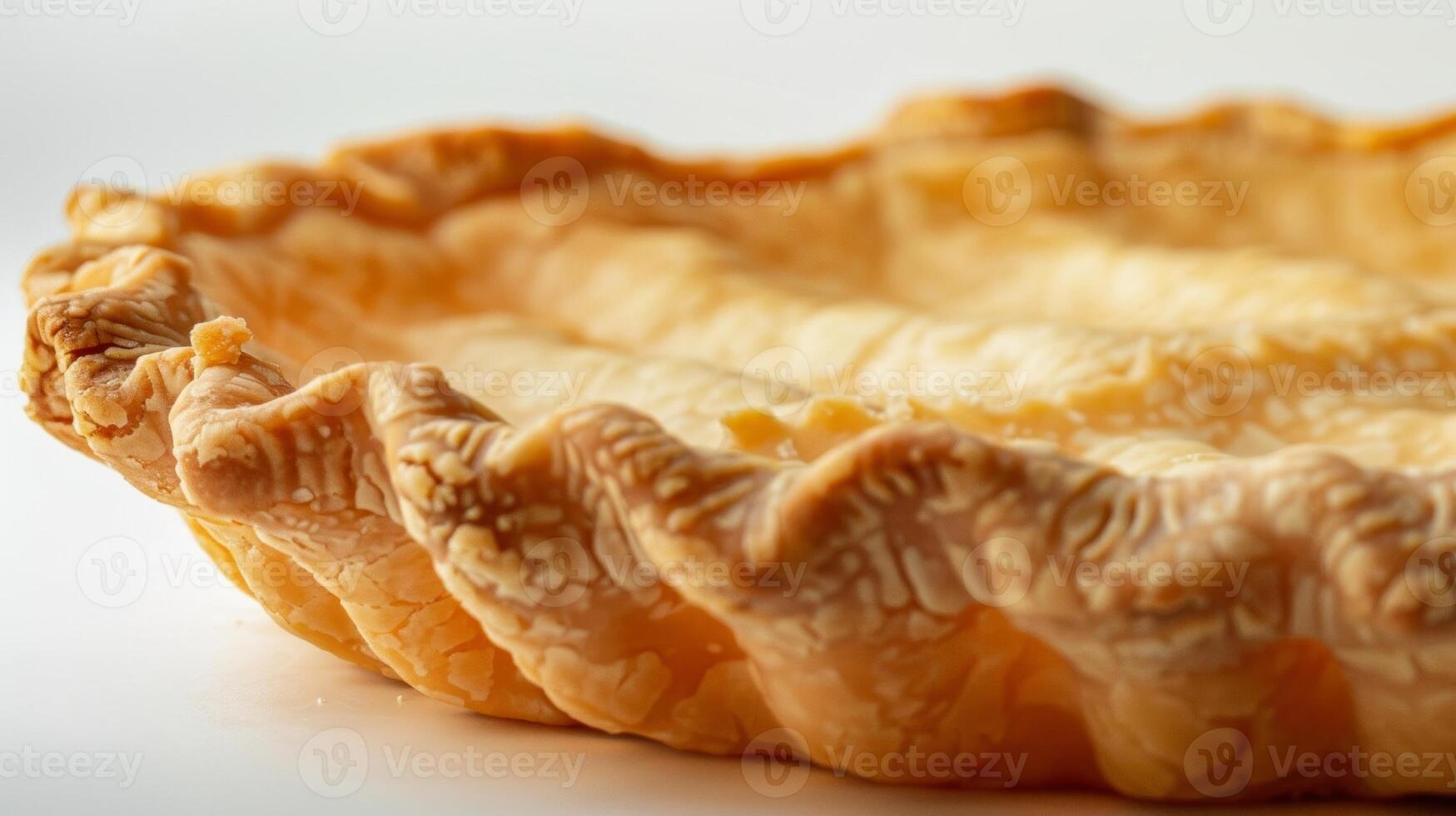 Crisp Edges The edges of the pie crust are fluted and crisp with small cracks and crevices adding dimension to the smooth surface photo