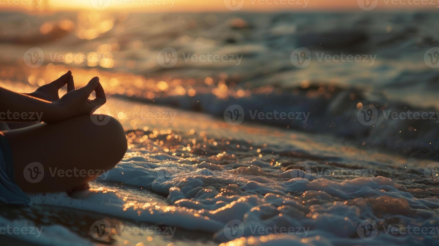 A person sitting on a beach meditating while watching the waves showcasing the restorative and calming effects of daily meditation by the ocean photo