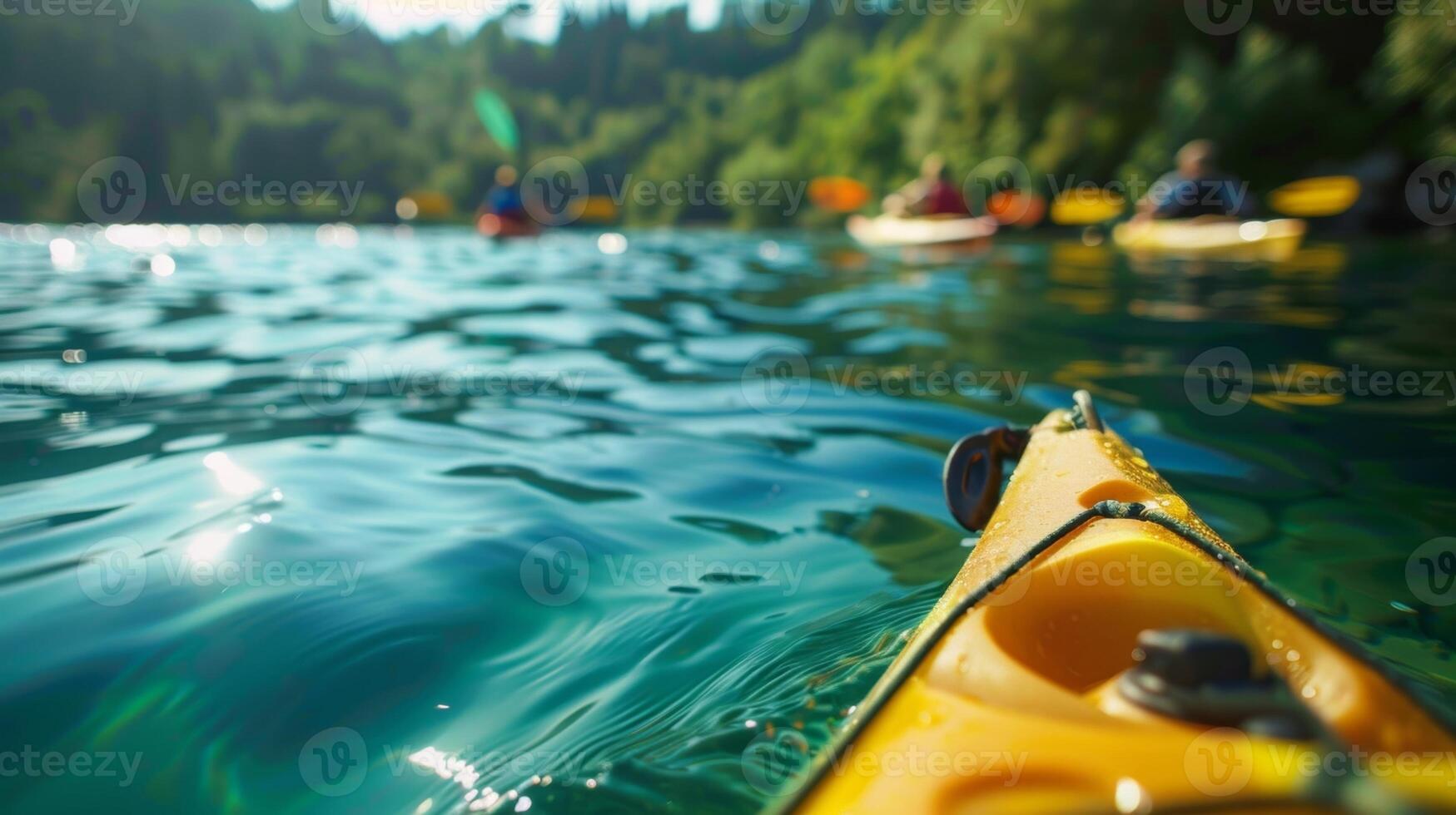 A group of individuals kayaking on a tranquil lake enjoying the clear blue water and scenic surroundings photo