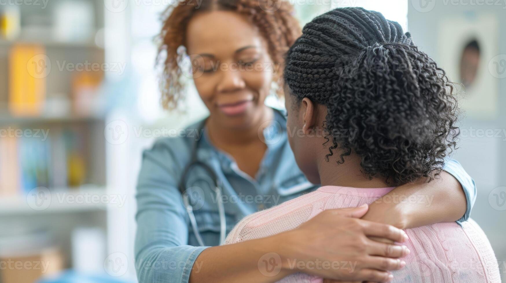 A mental health professional using touch therapy by placing a hand on their patients shoulders during a sessio photo