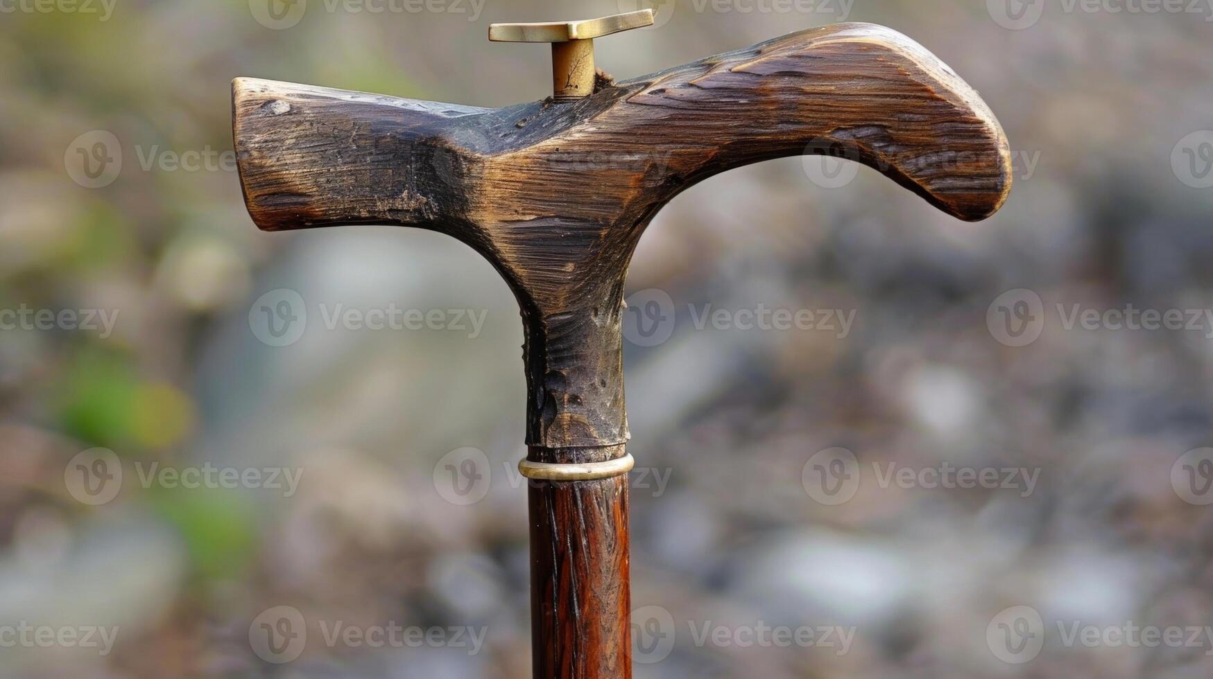 A walking stick with a fourpronged base to prevent slipping or falling photo