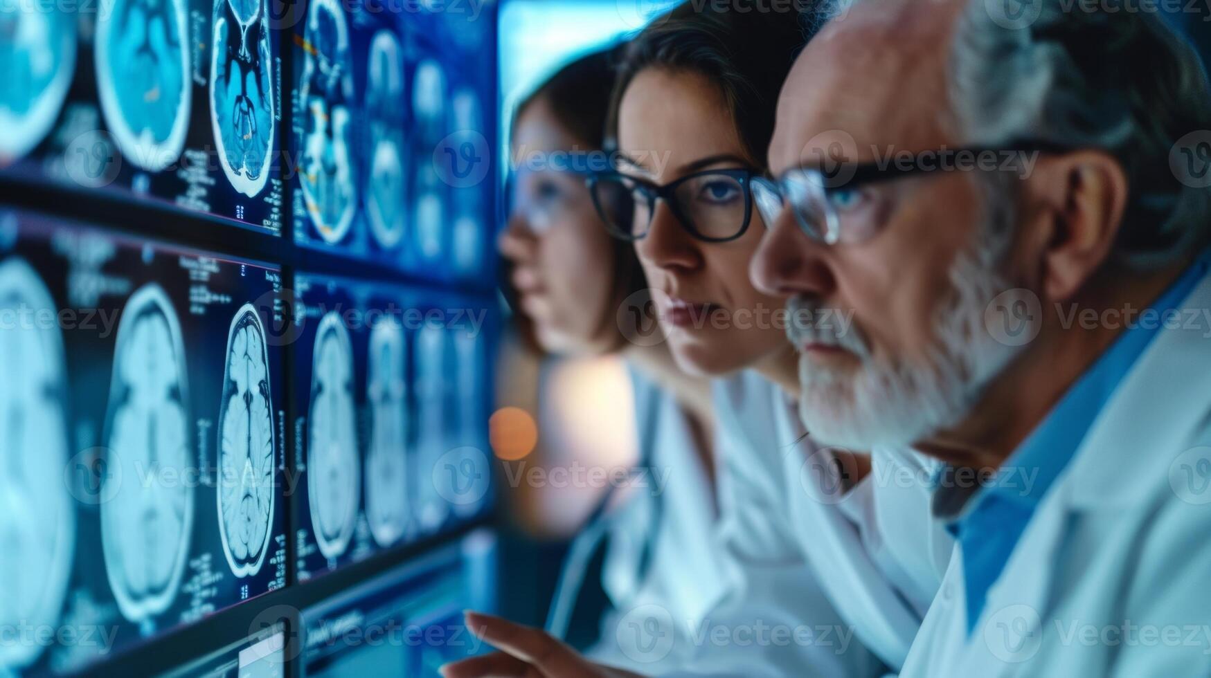 A team of researchers consulting and discussing data charts and results from their clinical trials on memory loss photo