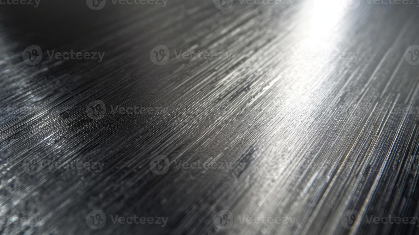 A matte finish on a smooth metallic plastic piece that mimics the look of brushed metal photo