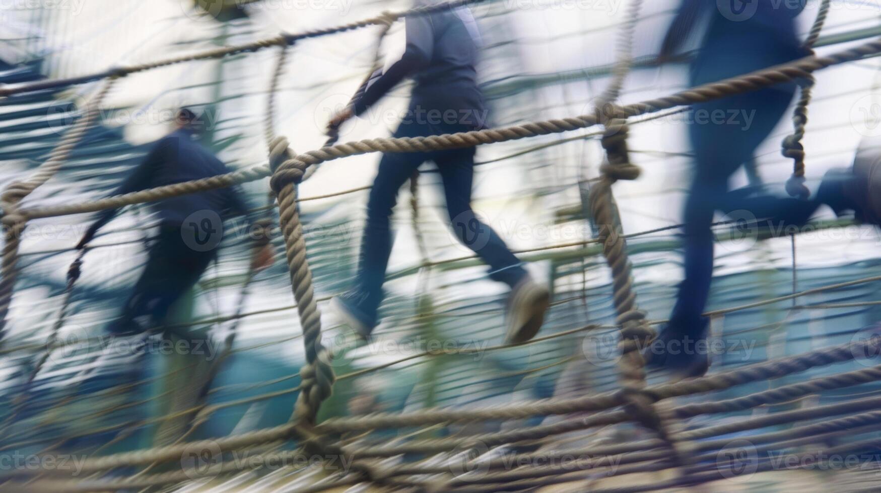 Hazy shot of colleagues navigating an obstacle course at the retreat photo
