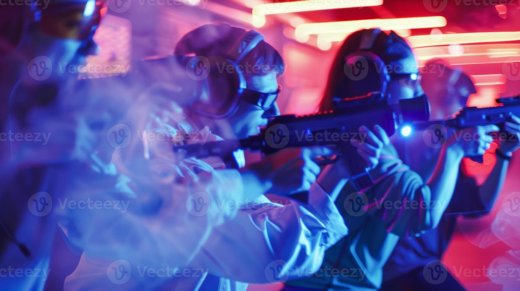 Blurry image of coworkers playing a game of laser tag as part of teambuilding activities photo
