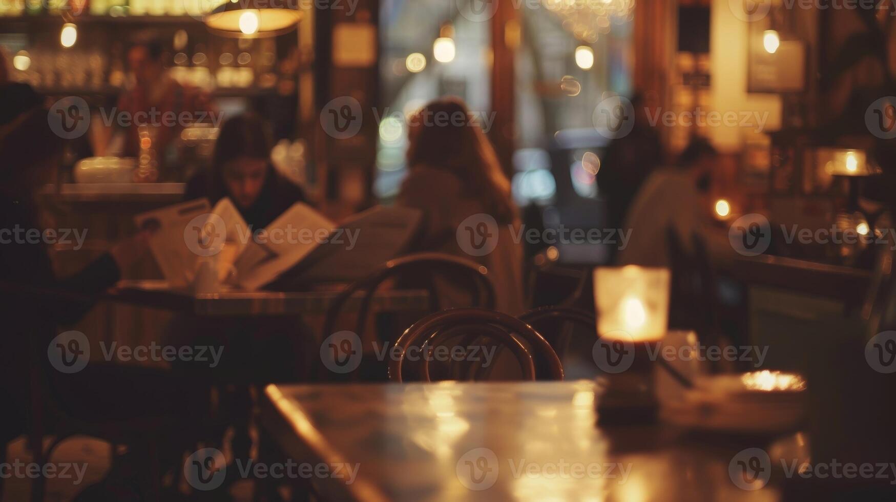 Dimly lit cafe with hazy figures reading books and newspaper photo