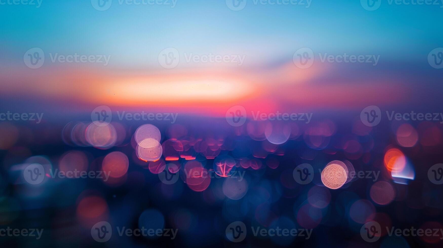 Defocused The bustling city lights blur and smear together creating an otherworldly distortion as the last rays of daylight vanish into the dusk sky. photo