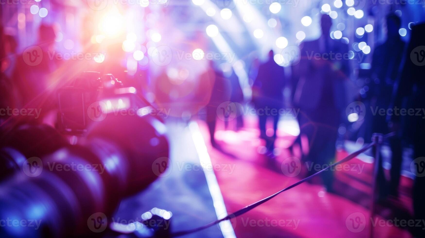 Capturing the essence of a starstudded movie premiere with defocused flashes of paparazzi cameras and the silhouettes of welldressed attendees walking the red carpet. The excitement photo