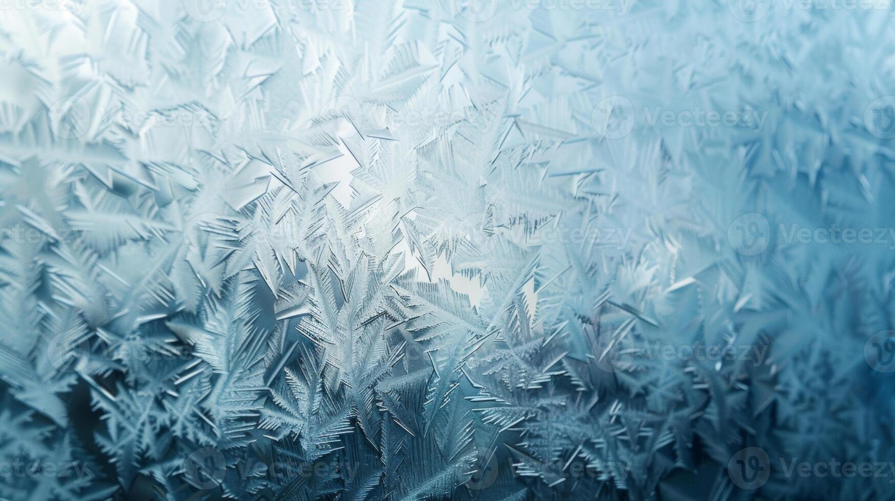 Defocused The textured ice formations on the frosted glass resemble an abstract art piece with a gradient of blues and whites adding depth to the image. In the backdrop the wintry photo