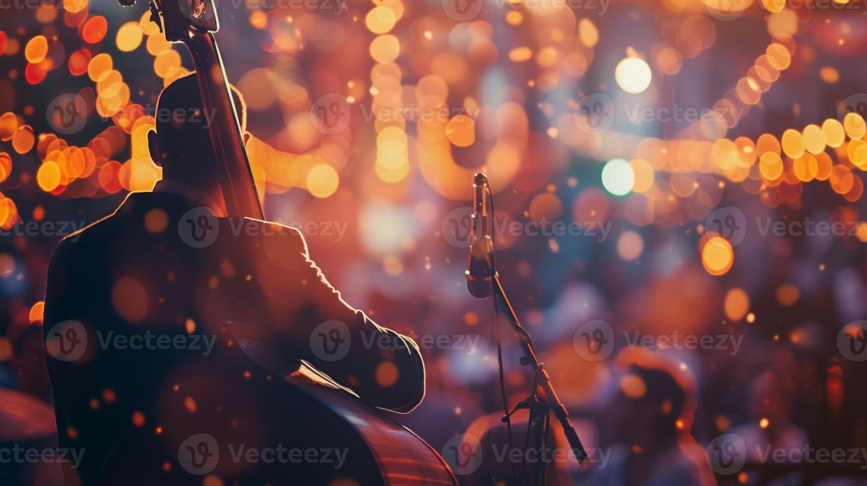 Amidst the blurred lights and hazy shapes the warm tones of a jazz festival background exude a sense of intimacy and harmony. Its as if the music has enveloped the entire scene in photo