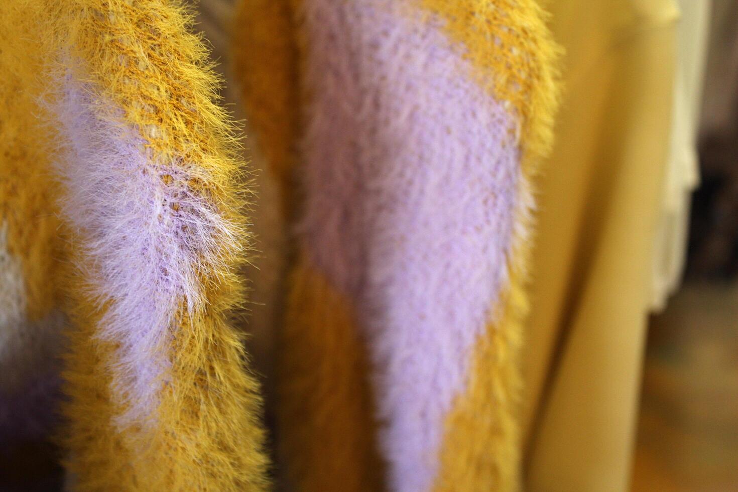 Funky Close Up of Fuzzy Purple and Gold Sweater photo
