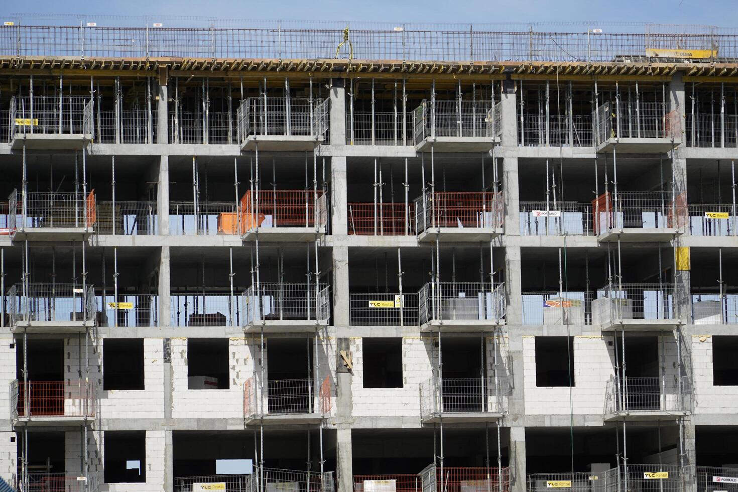 Warsaw, Poland, May 3rd 2024 - Building under construction with scaffolding photo