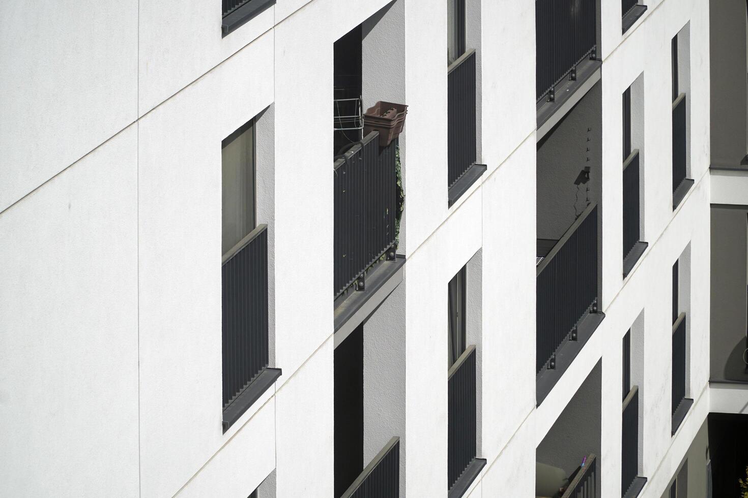 Warsaw, Poland, May 3rd 2024 - Modern residential building with balconies - close-up. Real estate and housing issues concept. photo