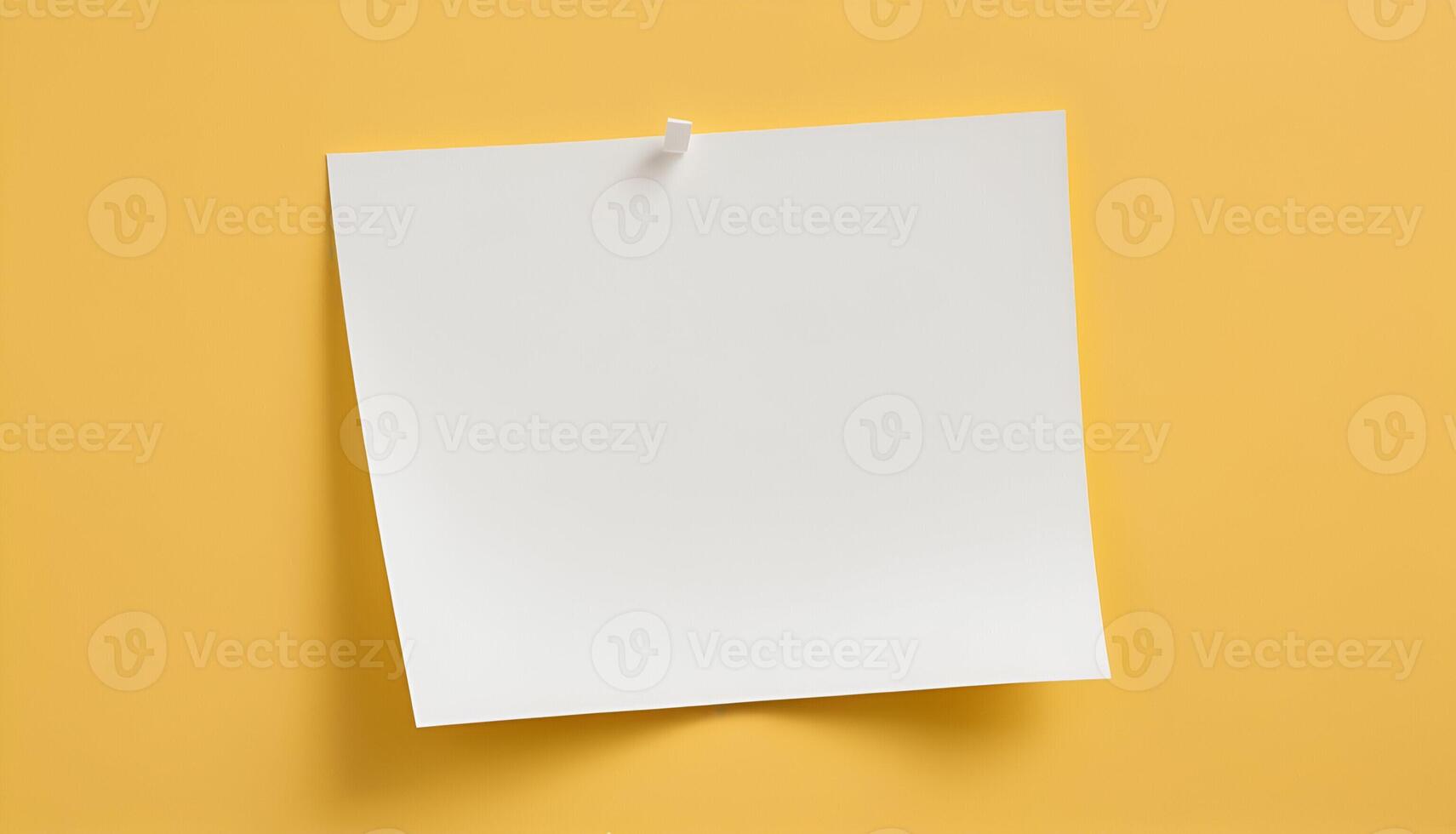 blank paper on yellow background photo