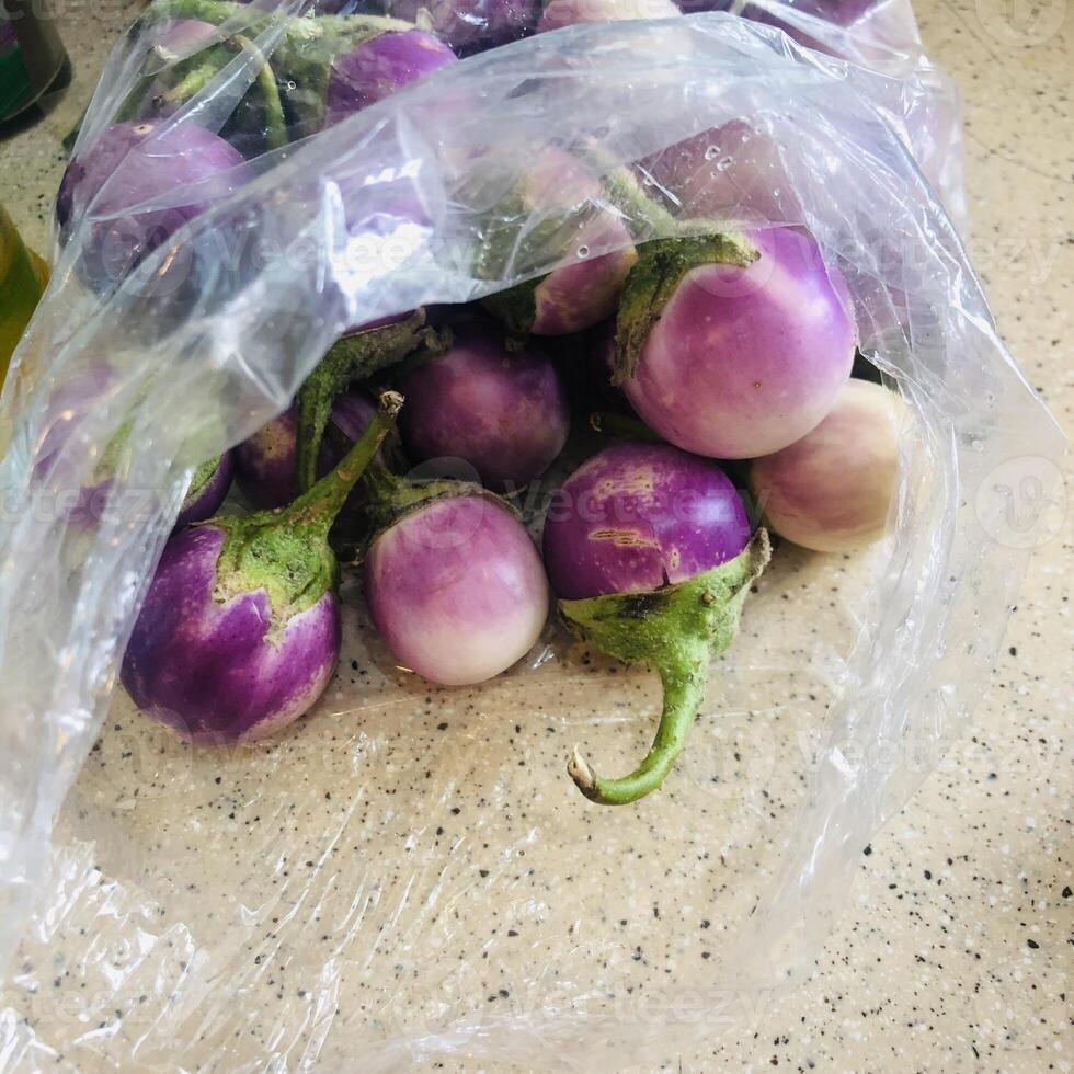 Round eggplant with leaves photo