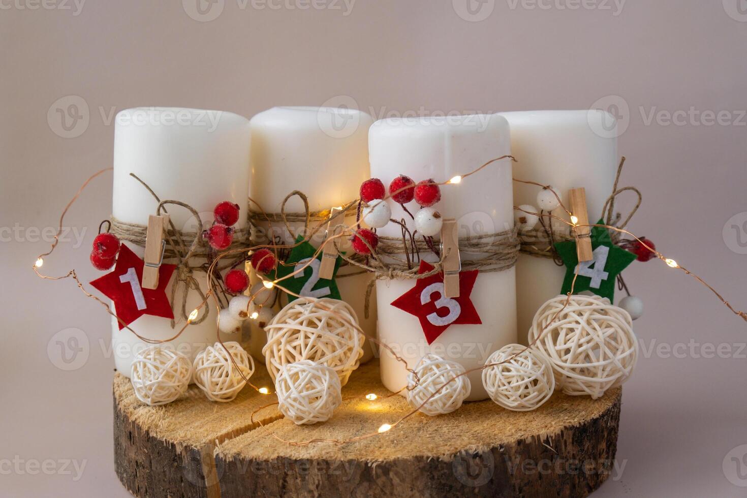 Step by step instruction of making handmade Christmas advent four weeks candle calendar. Female hands creating craft homemade decor. New year celebration. Winter holidays. Do it yourself photo
