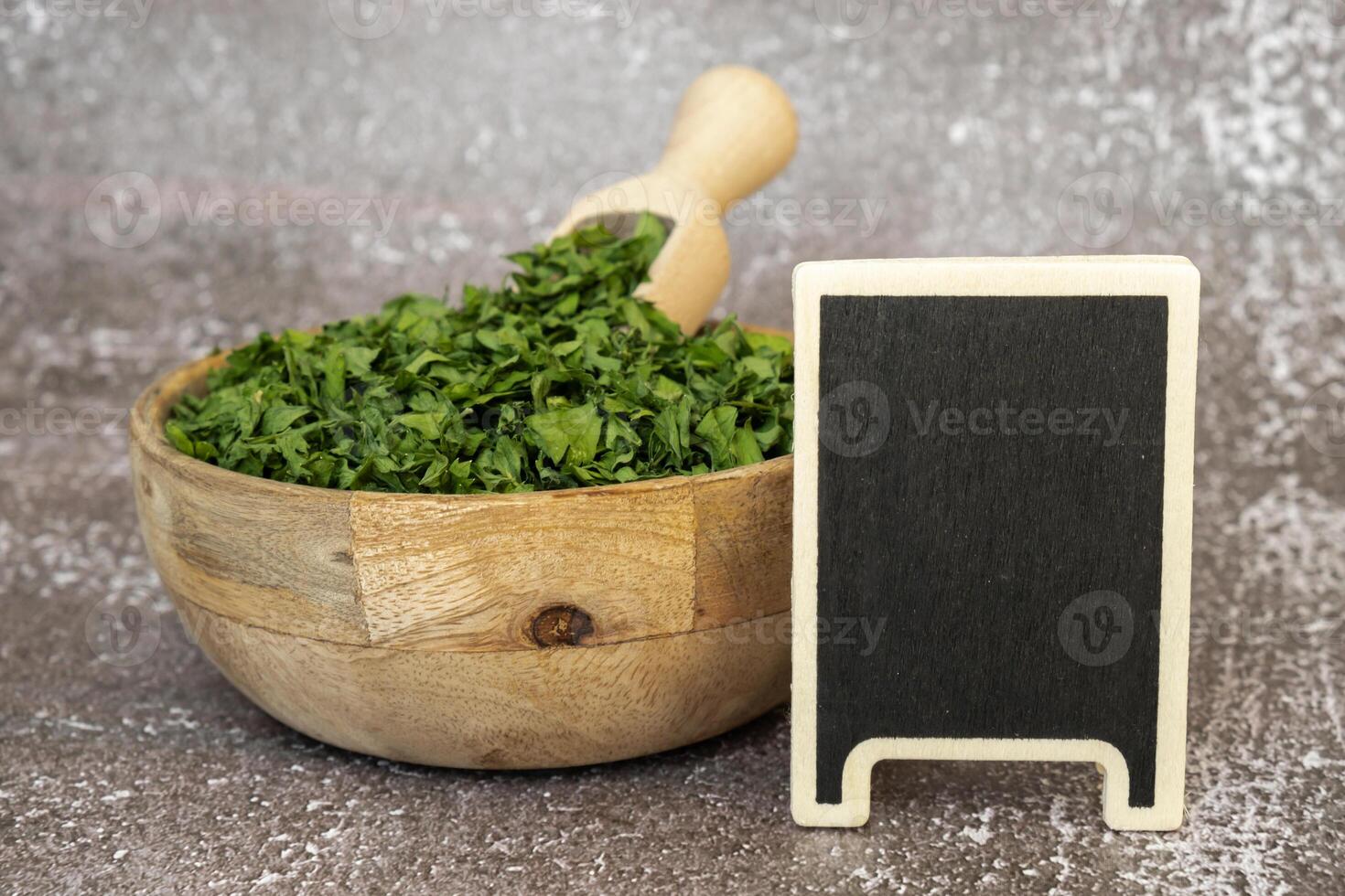 Wooden bowl with green dry parsley. Copy space mock-up template. Vegetarian bio organic salad herb healthy eating. Home garden immunity-boosting herbs. Seasonal harvest cottagecore photo
