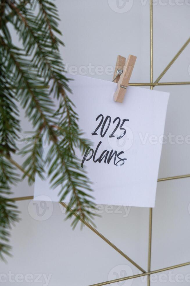 Motivational saying 2025 PLANS. New year goals setting concept. Strategy for self development improvement. Inspirational Planning better healthier life. photo
