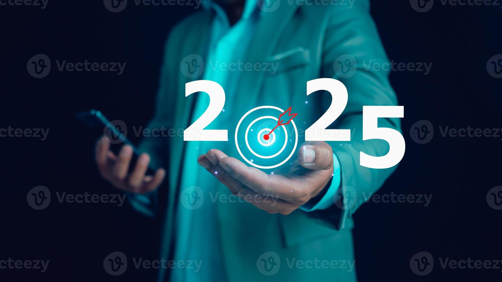 Businessman holds text 2025 with arrow target, Implementation of business goals plan, Set goals for 2025, Development to achieve goals and success. photo