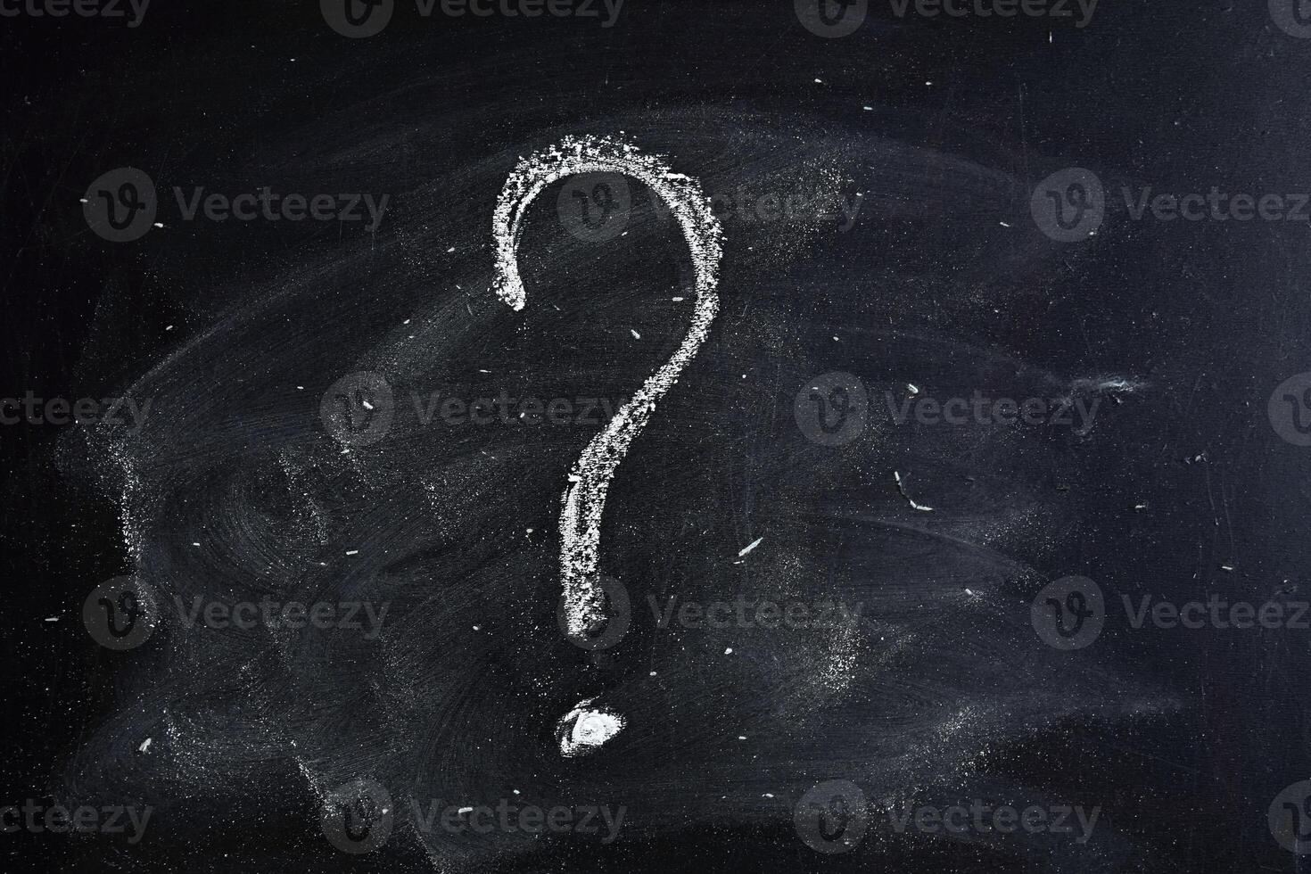 Question mark drawn in chalk on a blackboard photo