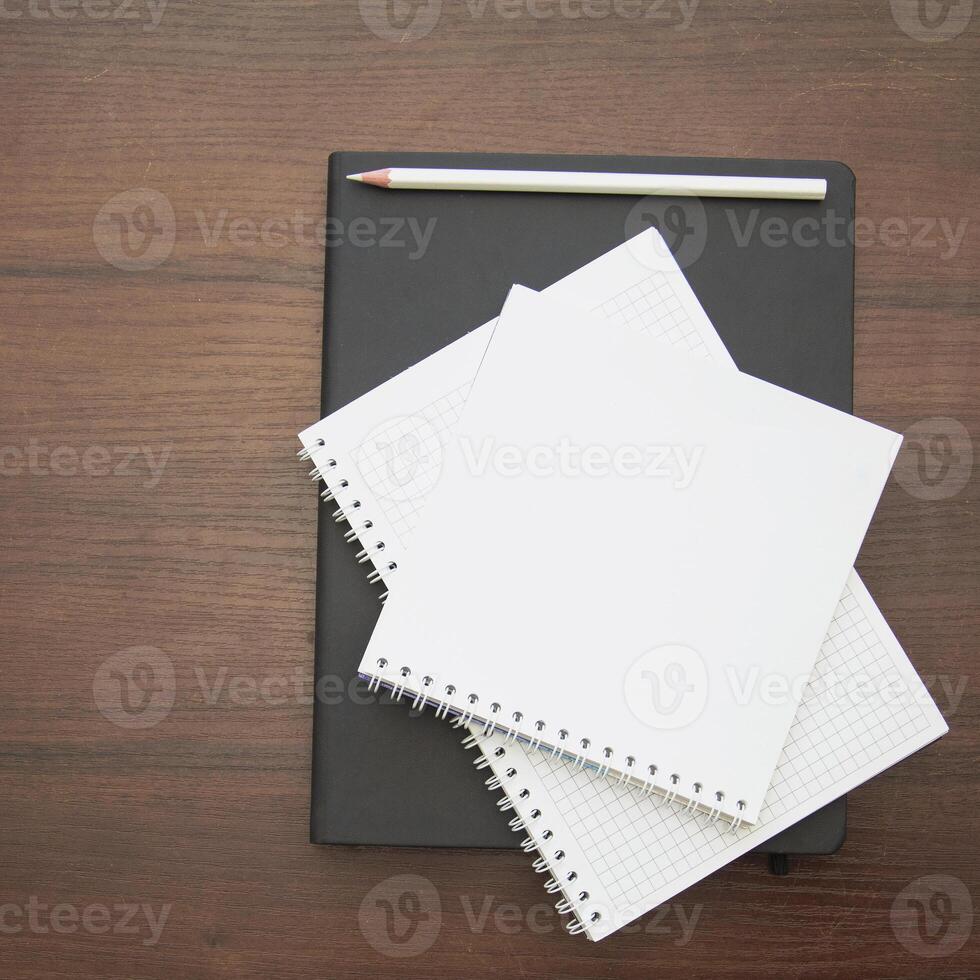 Notebook and pencil on a beautiful background in a large photo studio