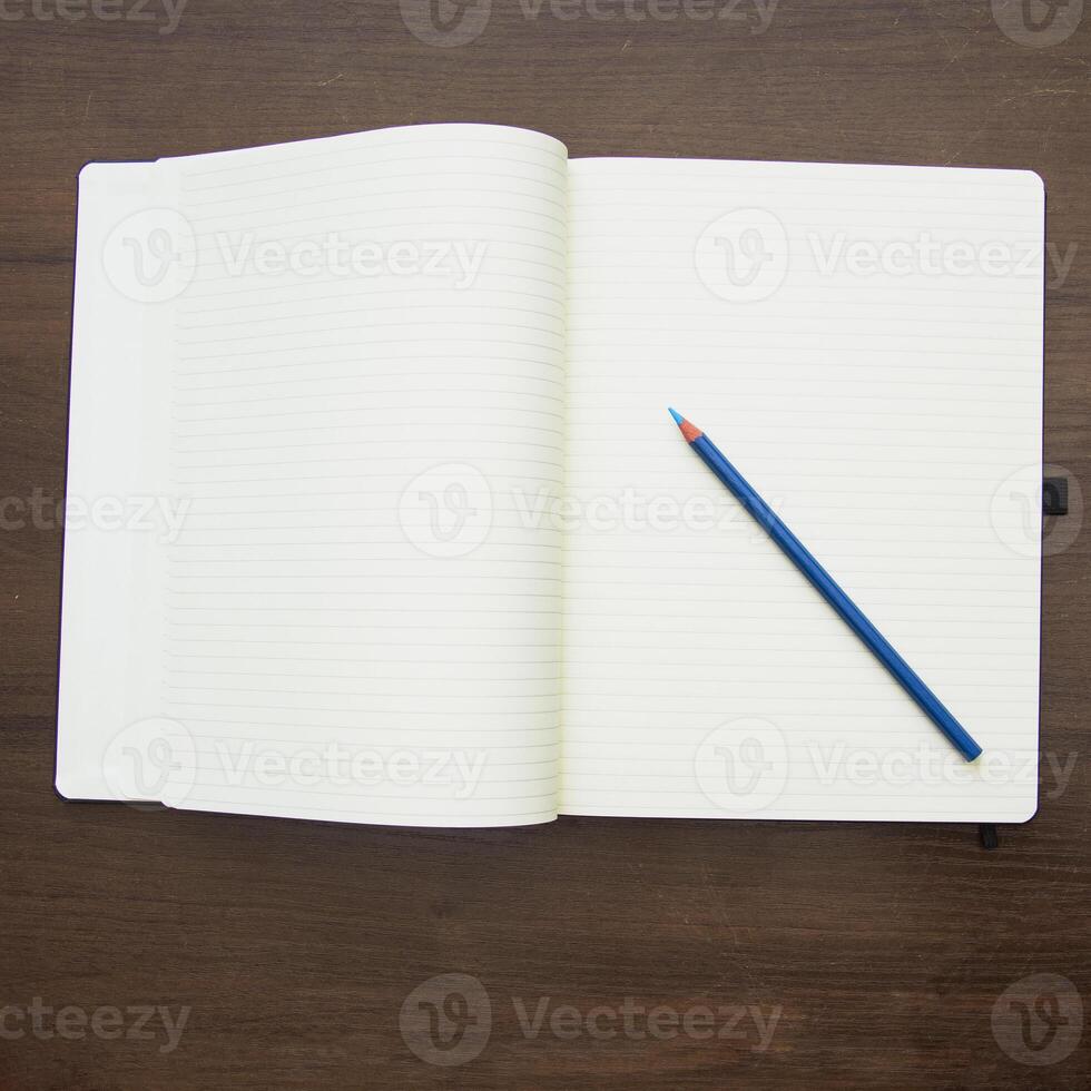 Notebook and pencil on a beautiful background in a large photo studio