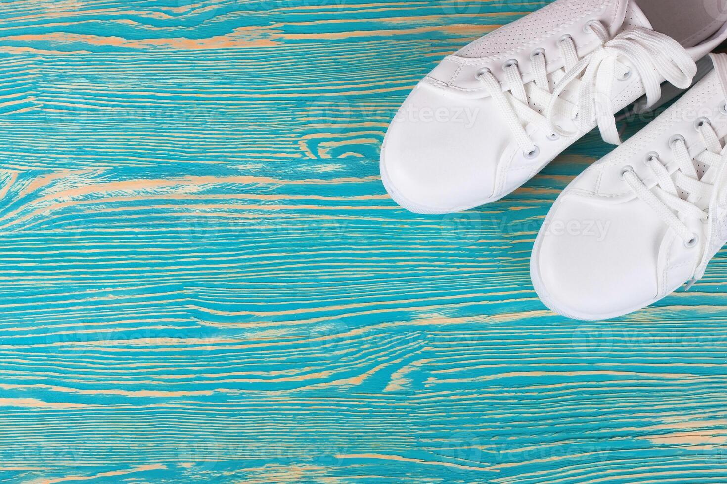 White sneakers on color background. copy space. photo
