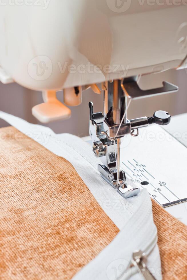 modern sewing machine presser foot and zipper photo