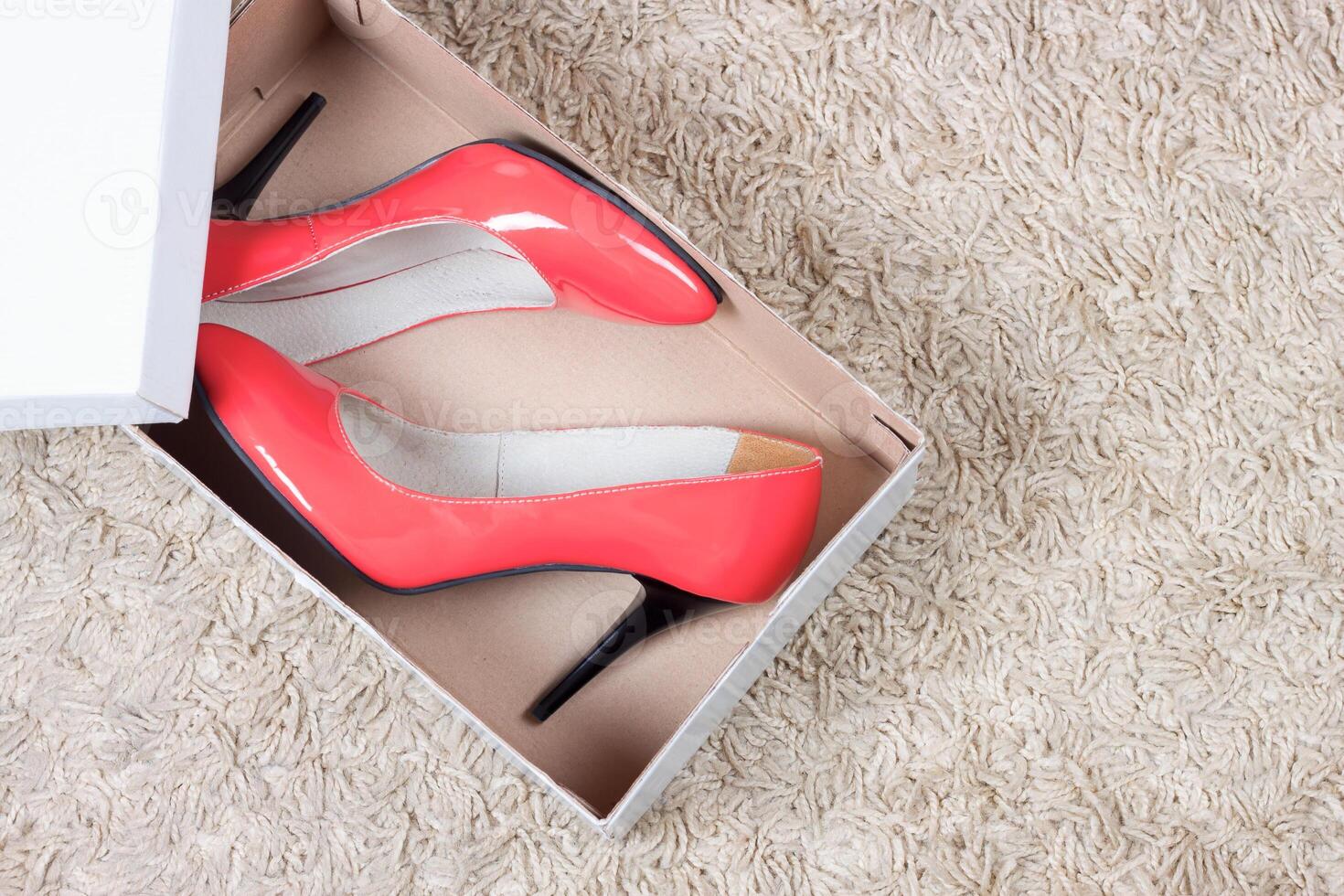 High heel red women shoes in shoe box photo