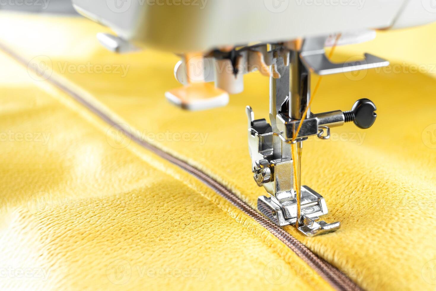 Modern sewing machine and yellow fabric. Sewing process, handmade, hobby, DIY, business, repair photo