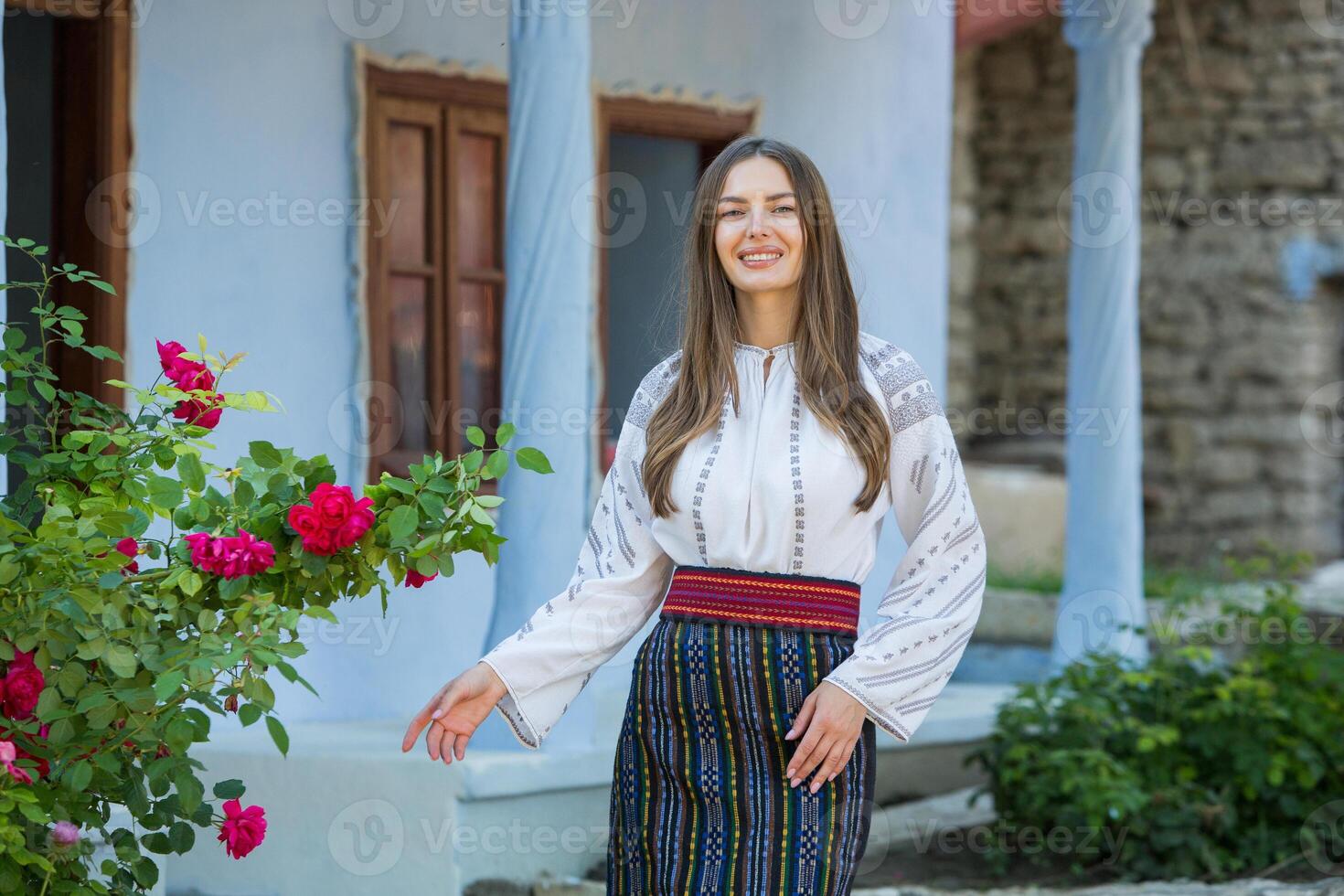 Beautiful traditional costume from Republic of Moldova. Young girl wearing Romanian traditional blouse. photo